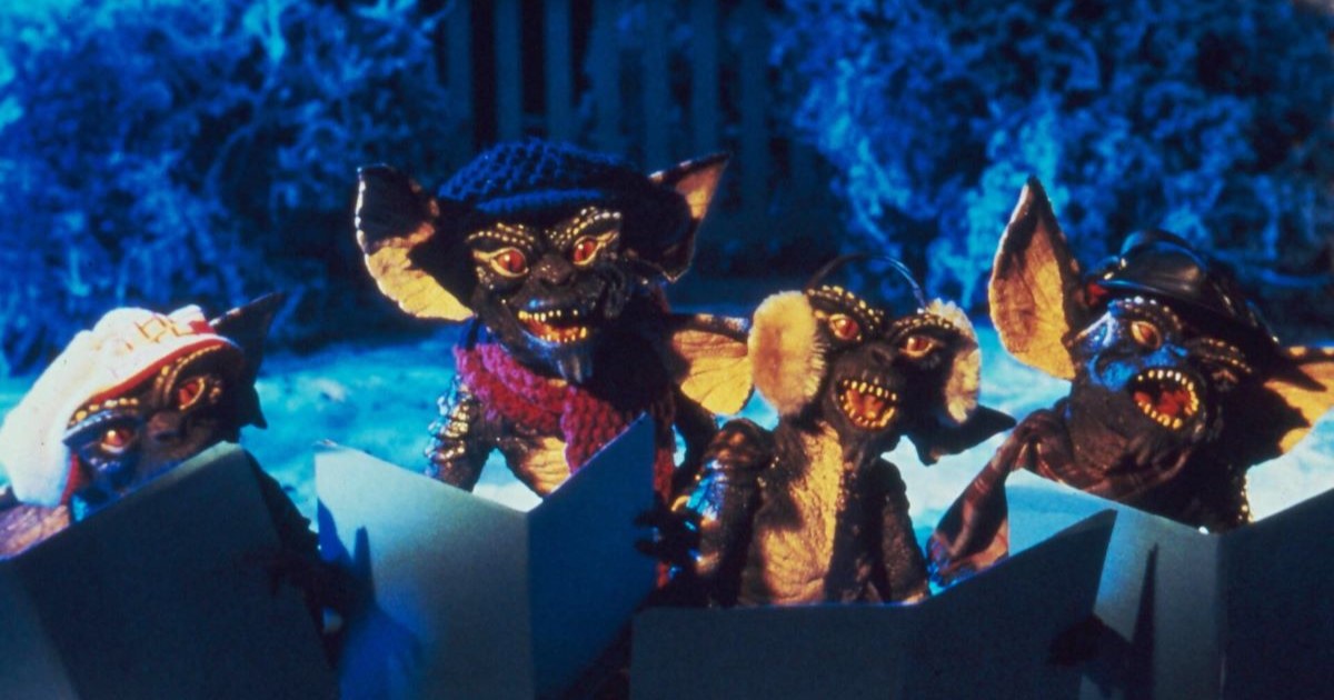 4 gremlin goblins singing in snowy garden